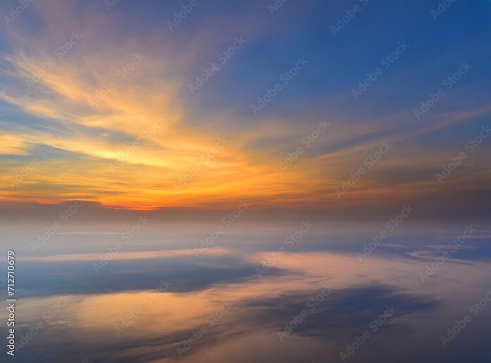 Sunrise on the sky, view from an airplane. Travel background/wallpaper with orange clouds and copy space.