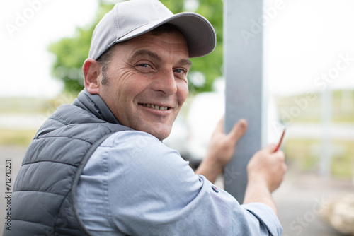 happy man working with metal bars