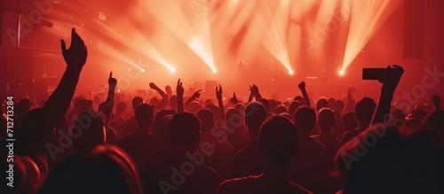 a crowd at a concert with lights