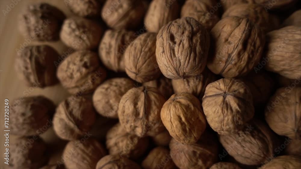 Walnuts. Camera slowly moves up to show close-up of beautiful walnuts Walnuts. Camera slowly moves up to show close-up of beautiful walnuts