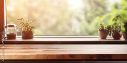 Wooden table with blurred kitchen window background for displaying products.