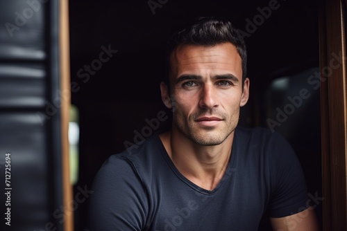 Portrait of a handsome young man in a black t-shirt