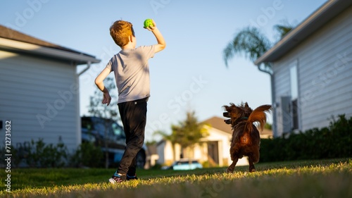 Canvas Print Boy Throwing Ball to Dog