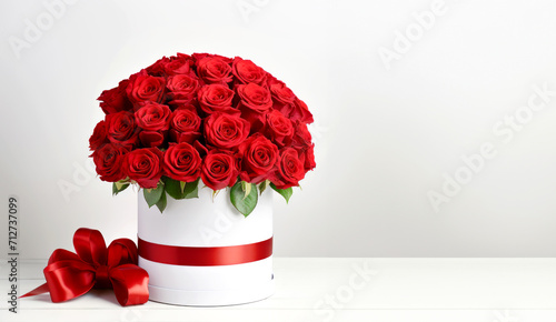 Red roses bouquet in white round box. Flowers gift