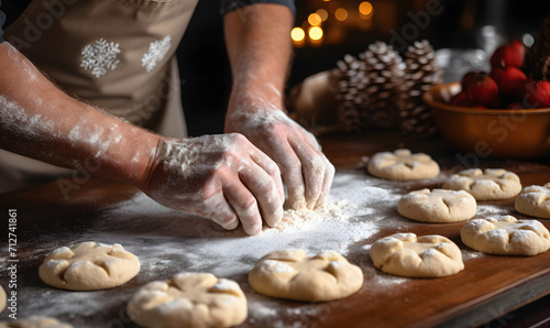 Traditional Christmas homemade cookie baking. Man's hands kneading dough on table with flour and gingersnaps. Soft selective focus, lifestyle 
