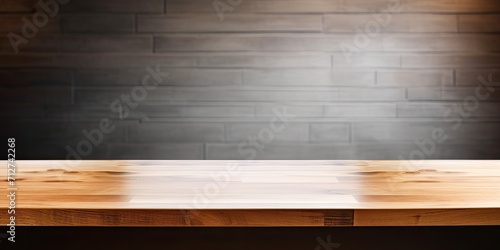 Wooden table top in kitchen for product display, menu board with light on wall in restaurant.
