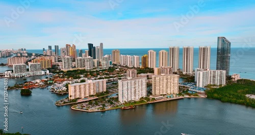 Multi-storied blocks of flats on the islands in the bay of the Atlantic Ocean. Scenic view of Miami Beach from top. photo