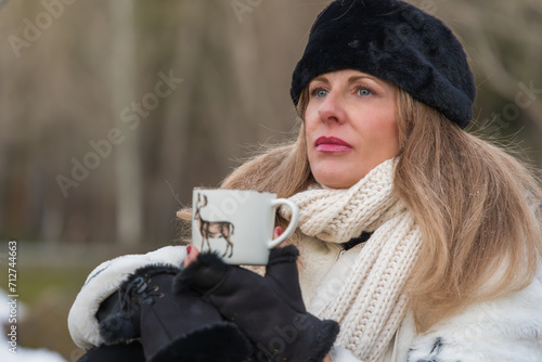 Close-Up of Woman Enjoying Coffee in Winter © Alejandro