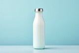 For industrial design. model of milk bottle made of glass with silver cap. on light blue background.