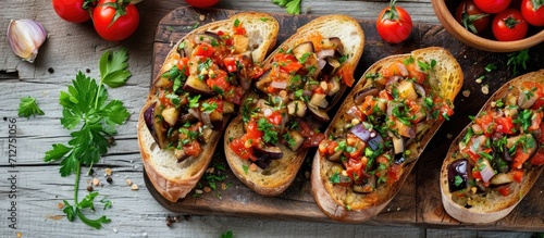 Healthy vegetarian appetizer: Toasted bread with eggplant caviar or antipasti. photo