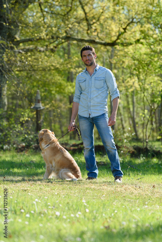 picture of a man with his dog on leash © auremar