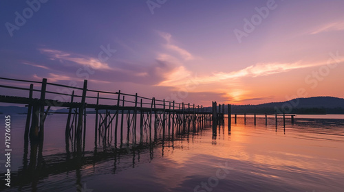 Dock overlooking a calm overcast lake background. Dock overlooking a calm overcast lake landscapes. Hdr landscape view. Old dock with sunset  candles  lamb  lake  sun and forest. high quality photos.
