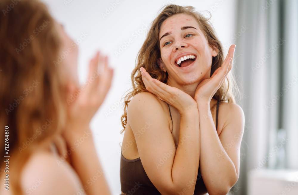 Skin Problem. Depressed Woman Touching Pimple On Face Looking At Mirror. Allergic reaction from cosmetic, red spot or rash on face. Beauty care. Skin Problem. Depressed Woman Touching Pimple On Face Looking At Mirror. Allergic reaction from cosmetic, red spot or rash on face. Beauty care.