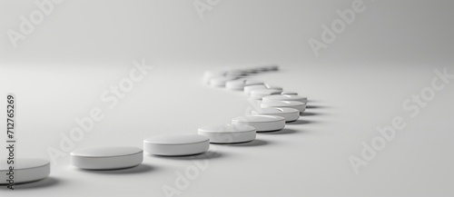 White pills  scattered on white background  copy space  banner. Concept  medicine  healthcare  pharmaceuticals