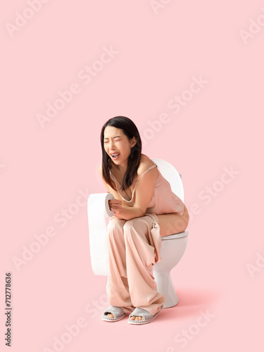 Young Asian woman in pajama...