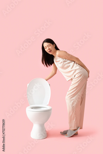 Young Asian woman in pajama...