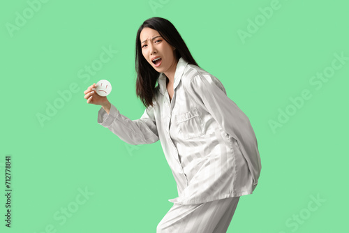 Young Asian woman in pajama...