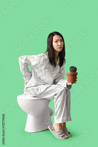 Young Asian woman in pajama...