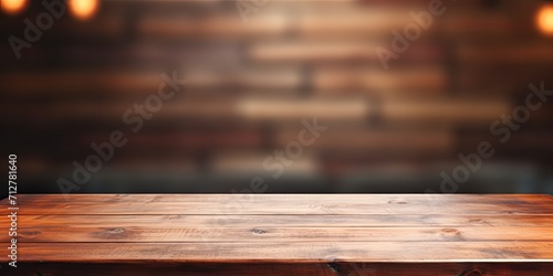 Table with empty space for decoration, pedestal, and workshop background blur.