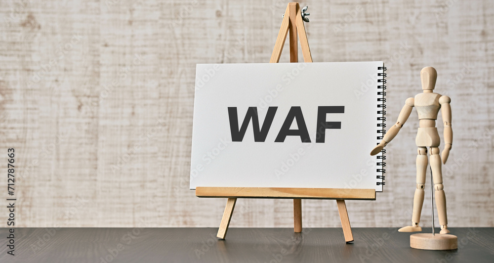 There is notebook with the word WAF. It is an abbreviation for Web Application Firewall as eye-catching image. - obrazy, fototapety, plakaty 