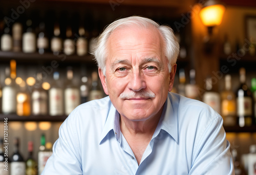 Smiling elderly white male bartender pouring a drinks at the bar. Age, bartender, hospitality concept.