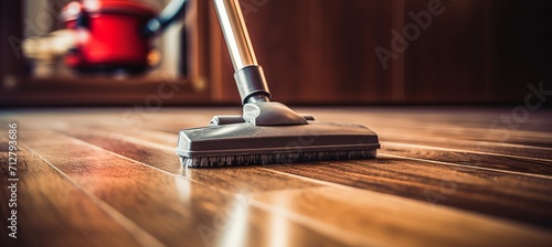 Close up of housewife using electric vacuum cleaner in living room for cleaning