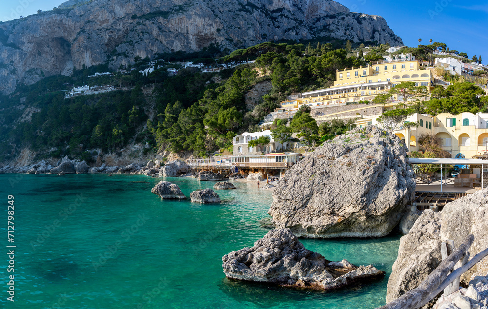 Bay on the island of Capri with crystal clear turquoise sea water, Italy