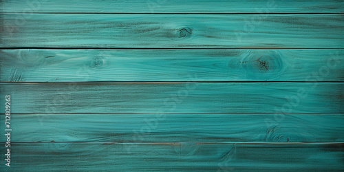 Close up of teal painted wooden planks. Wooden background texture an old wooden wall featuring a captivating combination of blue, brown turquoise, dark bronze, and luminous brushwork.