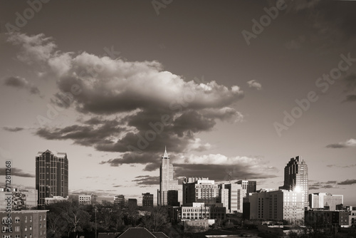 A dramatic city skyline of downtown Raleigh  North Carolina in the United States in black and white.