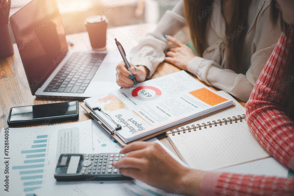Group of business people analysis summary graph reports of business operating expenses and work data about the company's financial statements. Group of business people analysis summary graph reports of business operating expenses and work data about the company's financial statements.