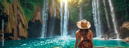 woman traveler and waterfall