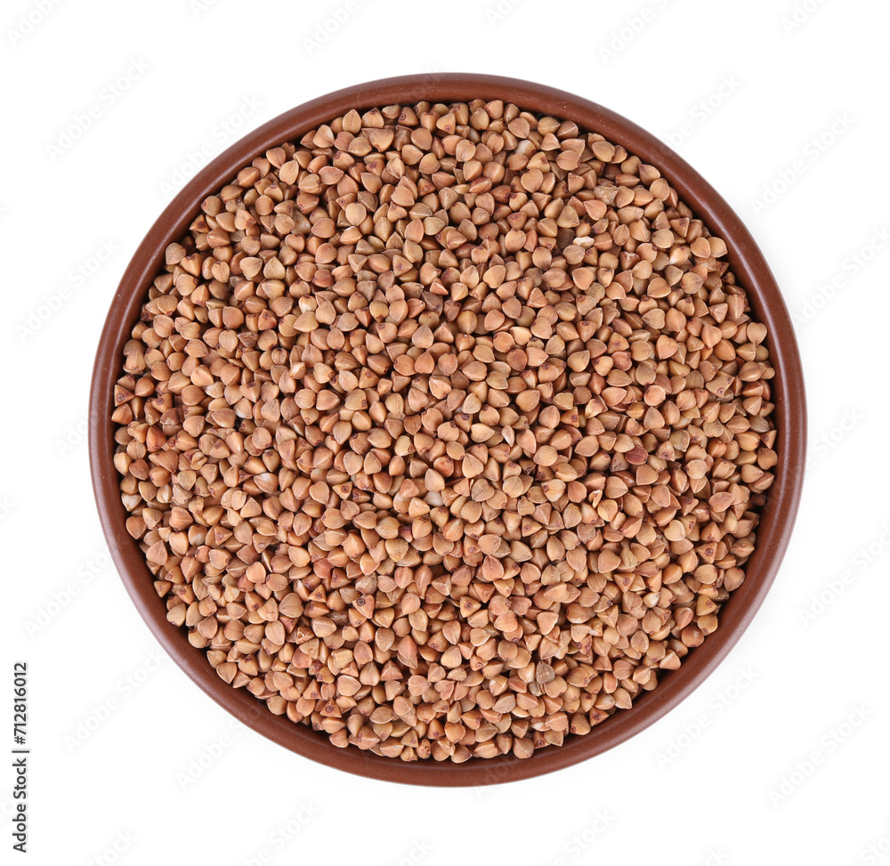 Raw buckwheat in bowl isolated on white, top view Raw buckwheat in bowl isolated on white, top view