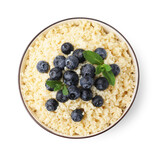 Bowl of tasty couscous with blueberries and mint isolated on white, top view