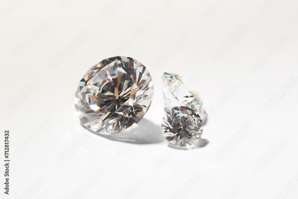 Different beautiful shiny diamonds on white background Different beautiful shiny diamonds on white background