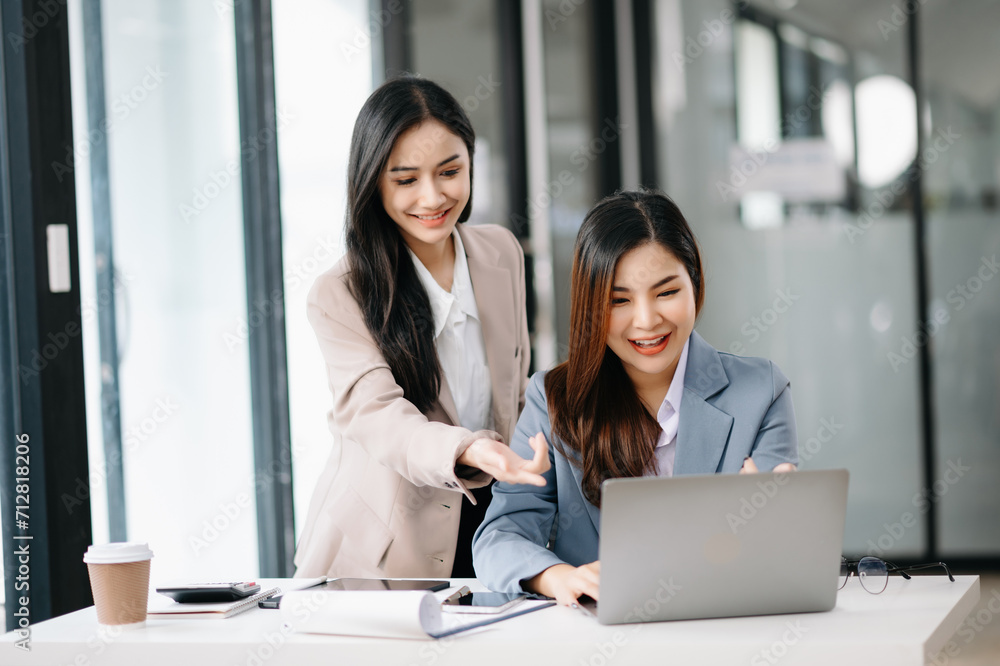 Portrait of success business people working together in office. Couple teamwork startup concept. Portrait of success business people working together in office. Couple teamwork startup concept.