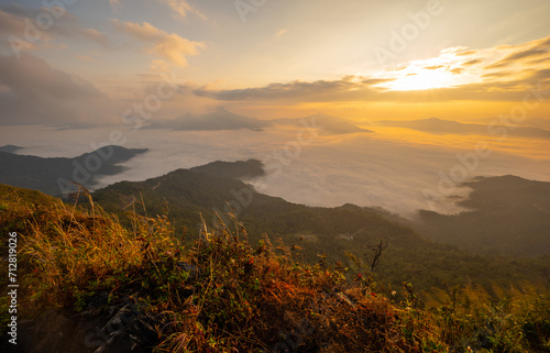 Beautiful sunrise view over Thai and Laos border seen from the top of Doi Pha Tang mountain in Chiang Rai province of Thailand.
