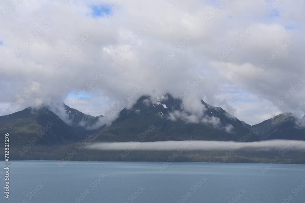 Cloudscape over mountain on Alaska coast