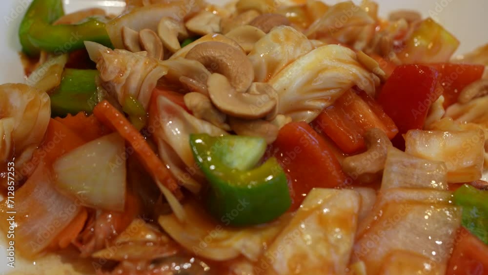 Thai food with stir fry vegetable and cashew nuts in sweet and sour sauce. Thai food with stir fry vegetable and cashew nuts in sweet and sour sauce.