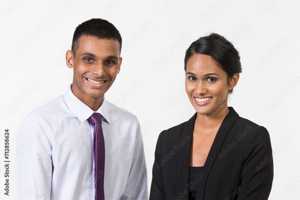 Portrait of a happy Indian business man & woman. Isolated on a white background. Portrait of a happy Indian business man & woman. Isolated on a white background.