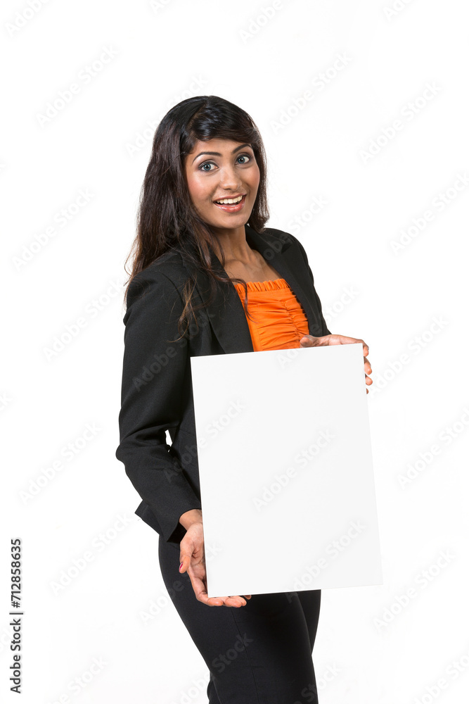Happy businesswoman holding a white banner and smiling Happy businesswoman holding a white banner and smiling