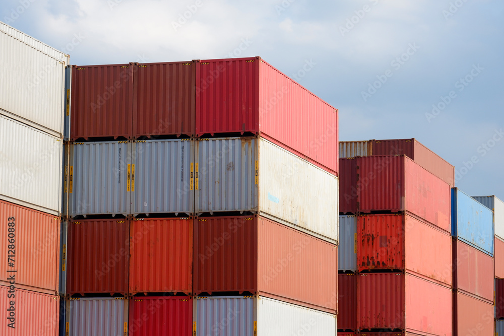 Stacks of shipping containers, import/export ships in seaports, industrial shipping freight, container logistics, maritime transport, distribution yard, commercial port business and transportation. Stacks of shipping containers, import/export ships in seaports, industrial shipping freight, container logistics, maritime transport, distribution yard, commercial port business and transportation.
