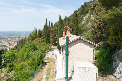 Small chapel  with bell tower built in hillside of Mt Ingino photo