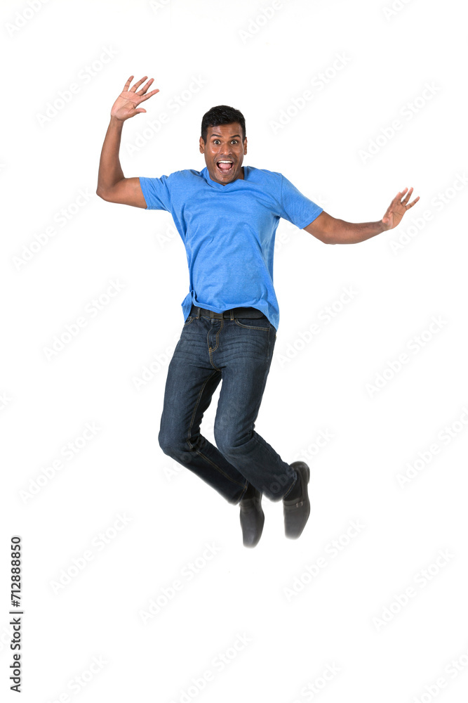 Excited Indian man jumping for joy.