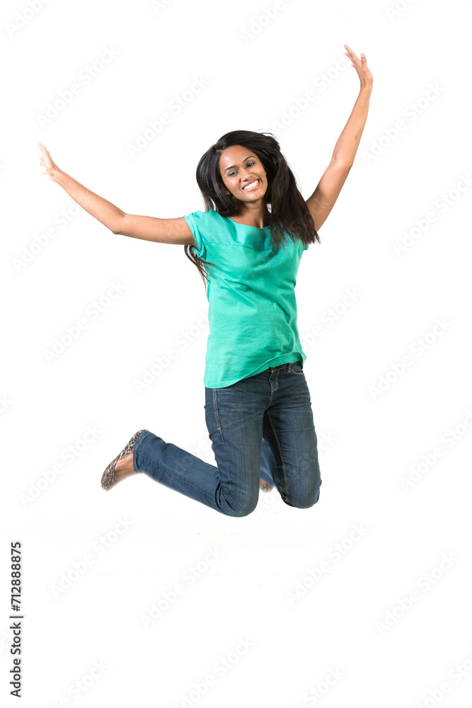 Excited Indian woman jumping for joy.