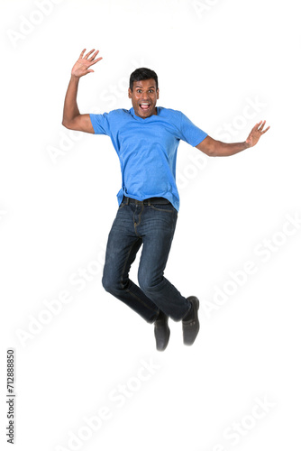 Excited Indian man jumping for joy.