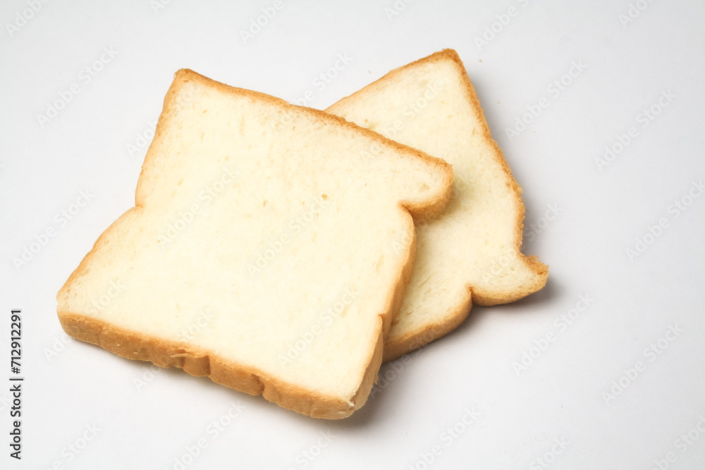 slice of bread 2 served on a white plate, isolated slice of bread 2 served on a white plate, isolated