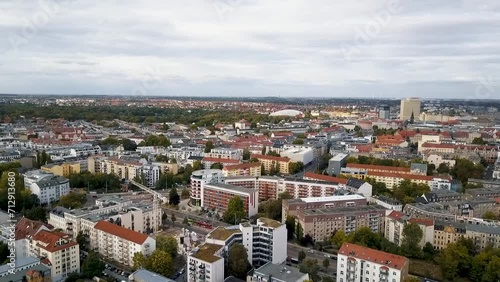 A rising drone shot of downtown Leipzig, Germany on a cloudy day photo