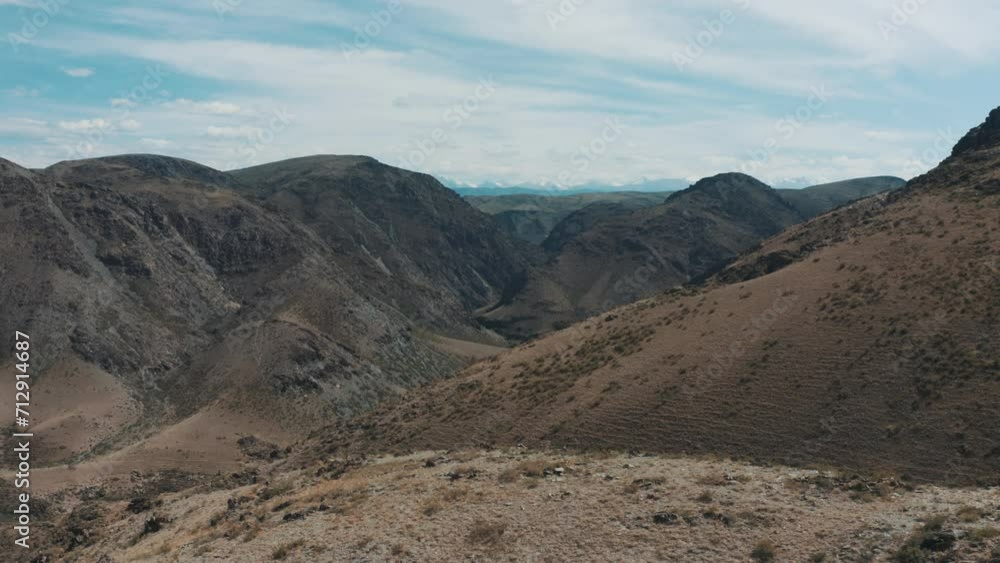 This stock video shows aerial photography of the mountains on a summer day. This video will decorate your projects related to mountain landscapes, mountains, travel, tourism. This stock video shows aerial photography of the mountains on a summer day. This video will decorate your projects related to mountain landscapes, mountains, travel, tourism.