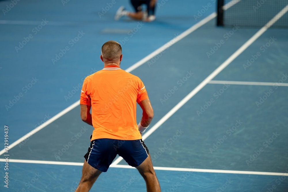 playing a tennis match at the australian open in summer