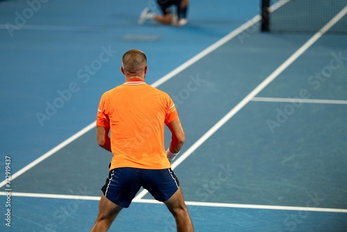 playing a tennis match at the australian open in summer © William